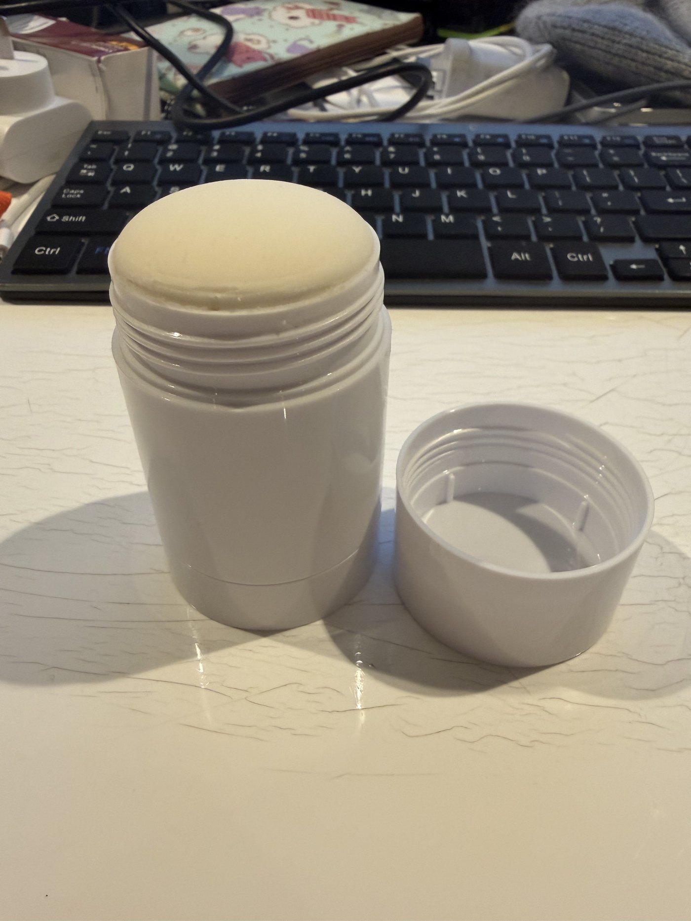 The anti-chafing balm with the cap off, showing the balm surface